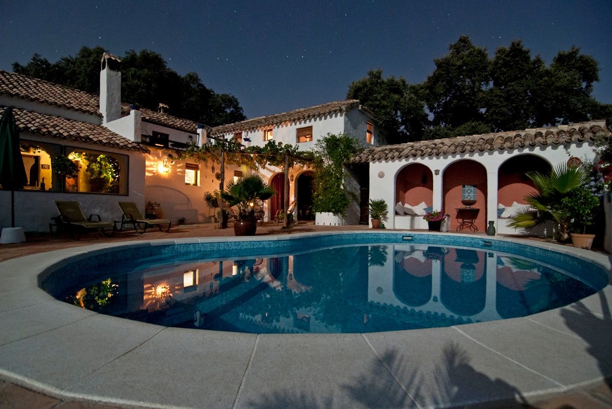 White Mediterranean villa surrounded by trees